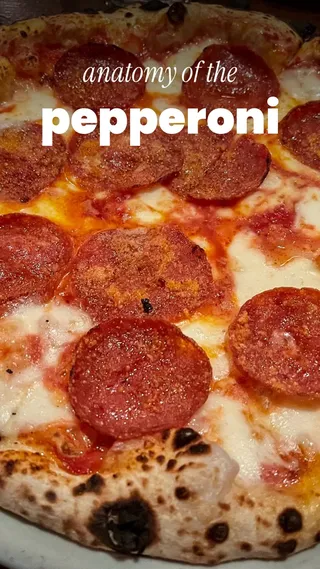 Frame from the Marlow’s Pizza fictional video ad
